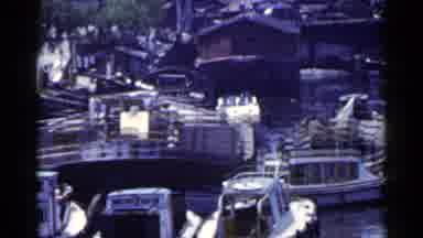Japan (1953): A Boat Alleyway Filled With Boats On A Sunny Afternoon In The Ocean