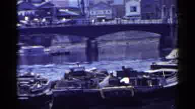 Japan (1953): Sweeping A River A Busy Boat Dock And A Bridge