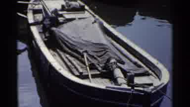Japan (1953): Four Small Passenger Boats Sit In The Water At A Dock Partially