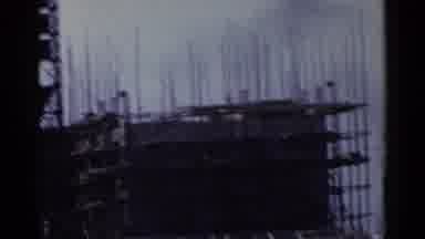 Japan (1953): Scene From A Building Site Then Few Shacks And Some Smoke Going Up