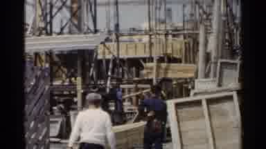 Japan (1953): People Watching And Workers In Construction Site For A Building