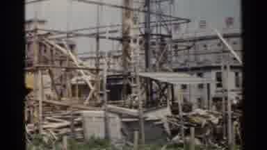 Japan (1953): Old Construction Site With Yellow Iron Bars And Working Car