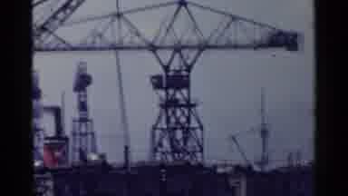 Japan (1953): Cranes And Bridges Over Water Crowded With Many Boats And Workers