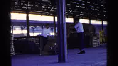 Japan (1953): Two Guys On Loading Dock Work Together To Load Hand Cart And One Guy