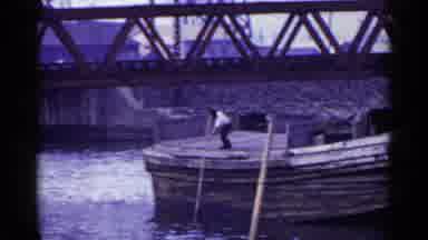 Japan (1953): A Single Man Moving A Very Large Boat With A Long Pole