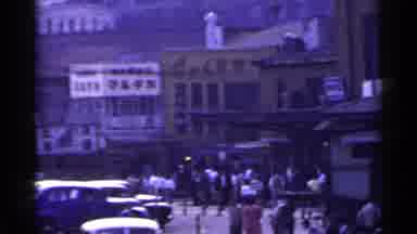 Japan (1953): Asian City Having Road Construction While Cars Are Driving By And