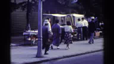 Japan (1953): People Walking Down A Sidewalk Past A Shoe Shining Station