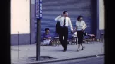 Japan (1953): Storefront And Three Women Sitting On The Ground While Other People