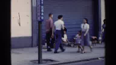Japan (1953): People Walking On Walking Down The Street And Other People Sitting