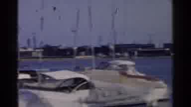 California-1955: Two People Walk Down Boat Dock