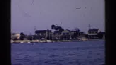 California (1955): Moving Transportation With A Water Buildings And A Boat