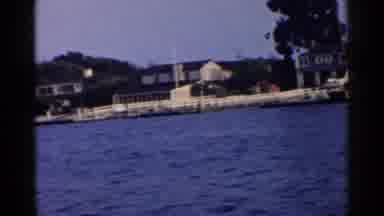 California (1955): Video Clip Of Houses By A Body Of Water As Someone Filming It