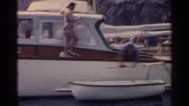 California (1955): A Couple Prepares A Rowboat Next To Their Yacht