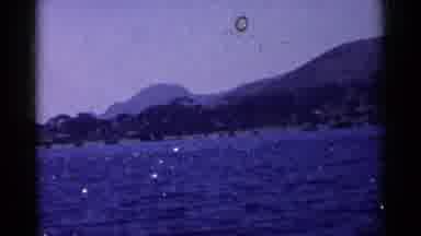 California (1955): A Mountains And Trees Alongside A Blue Lake