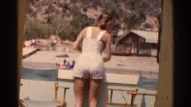 California (1955): A Smiling Babe In A White Bathing Suit Who Is Looking Mighty