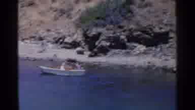 California (1955): People On Rowboat Struggling To Move Away From Lake Shore