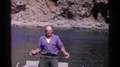 California (1955): Men Cleaning Clams Along The Cliff Sitting In Their Boat