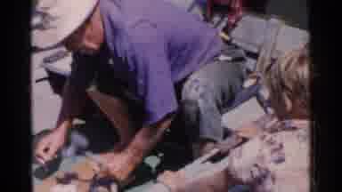 CALIFORNIA-1955: Grandfather Teaching Child Boat Maintenance
