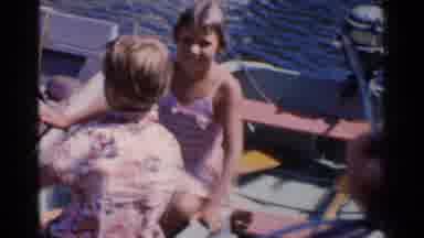California (1955): Kids Sitting White Boat Wave To Camera On A Sunny Day