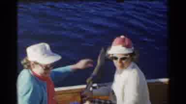 CALIFORNIA-1955: Two Old Ladies Sitting In A Rocking Boat Together On A Blue