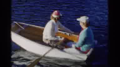 California (1955): A Woman Rows A Small Boat In A Lake While Another Woman Sits