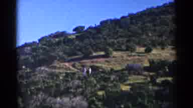 California (1955): Green Hills Blue Sky And A White Boat On A Bright Sunny Day
