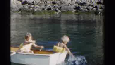 California (1955): Two Cute Little Girls Playing And Paddling On The Water
