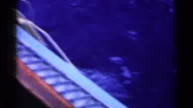 California (1955): Woman Reels In A Rage Fish On The Boat In The Middle Of The
