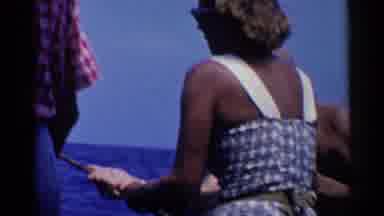 California (1955): Tanned Women In Cute Summer Dress Caught Small Fish Trying To