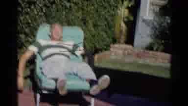 California (1955): Man Sunbathes Fully Clothed While Woman Comes Close And Kisses