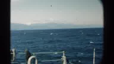 Pearl Harbor Hawaii (1958): Ocean And Waves While On A Boat With Mountains In The