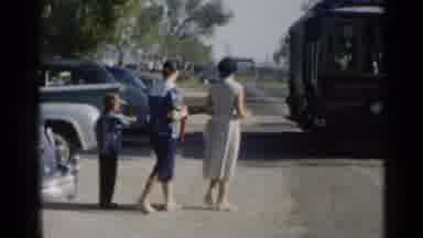Disneyland-1959: Mom Dad And Son Wait For The Trolley To Come And Get Them