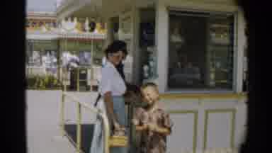 Disneyland-1959: A Woman and Child Buy Tickets at a Ticket Stand