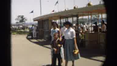 Disneyland (1959): Family With Happy Kid Going Away From A Party In City