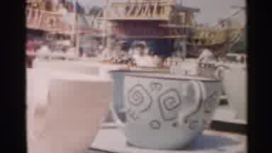 Disneyland (1959): People At An Amusement Park Ride In Teacups And Float Down