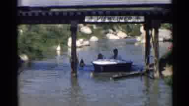 Disneyland (1959): Woman And Child Enjoying Riding In A Small Boat