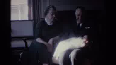 Ohio USA (1959): Older Woman And Man Holding A Tiny Newborn Baby As They Sit On A