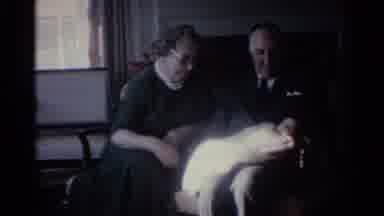Ohio USA (1959): Red Poinsettia Flowers Sit On Table Near White Fireplace And