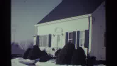 Ohio USA (1959): A Big White House With Shrubs Around It Covered With Snow