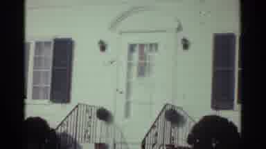 Ohio USA (1959): Vintage Motion Shot Of An Old White House With Green Bush And