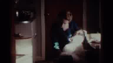 Ohio USA (1959): Woman Dresses And Plays With A Doll During Christmas And The Dog