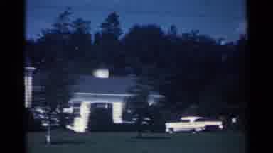 Ohio USA (1959): A Beautiful Neighborhood During The Day With A Blue Sky And Green