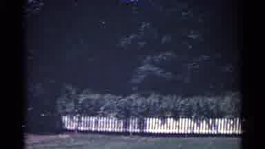 Ohio USA-1959: White Picket Fences And Forrest Rapidly Speed By The Back Yard