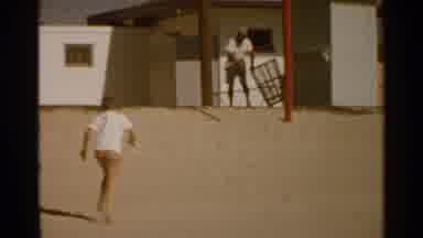 San Francisco (1959): Boy Runs Up The Hill Towards The Man Rolling Out A Large
