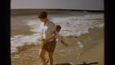 San Francisco (1959): Woman And Child Hanging Out By The Beach The Woman Picks