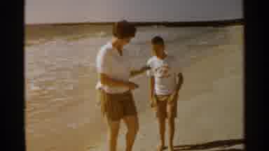 San Francisco (1959): Woman And Kid Dressed In White And Playing On The Beach Near