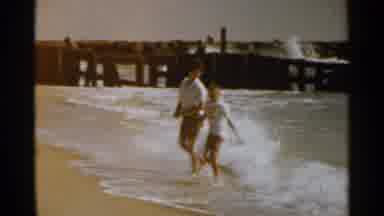 San Francisco (1959): A Boy And A Woman Run From The Incoming Tide At The Ocean's