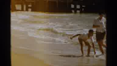 San Francisco (1959): Boy Wearing White Shirt Runs From Ocean Tide On A Sunny Day