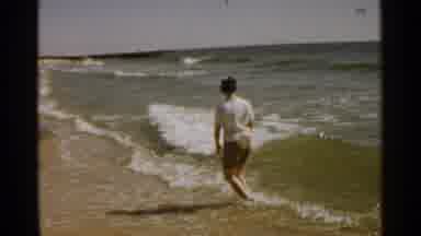 SAN FRANCISCO-1959: Boy Playing at the Beach on a Sunny Day