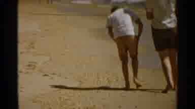 San Francisco (1959): Two People Slowly Walking On A Sand Beach Picking Something